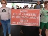 Demonstranten mit Schild, Berlin, 03.08.2024